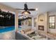 Charming outdoor patio with stone fireplace and comfortable seating at 7532 Greystone St, Lakewood Ranch, FL 34202