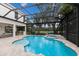 Beautiful screened-in pool with spa and lush golf course views at 7532 Greystone St, Lakewood Ranch, FL 34202