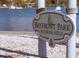 Bayfront Park mooring field sign with a sailboat emblem, next to a gravel path and bay at 7620 Westmoreland Dr, Sarasota, FL 34243