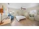 Comfortable bedroom with tiled floors, large window, and a water view at 7620 Westmoreland Dr, Sarasota, FL 34243