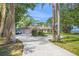 A one-story home with attached two-car garage, landscaping and water views at 7620 Westmoreland Dr, Sarasota, FL 34243