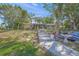 Charming home with landscaped front yard and serene waterfront views at 7620 Westmoreland Dr, Sarasota, FL 34243
