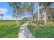 Well-manicured path leading towards the water on a sunny day at 7620 Westmoreland Dr, Sarasota, FL 34243