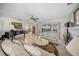 Bright living room with a fireplace, tile flooring, and sliding glass doors with water views at 7620 Westmoreland Dr, Sarasota, FL 34243