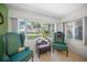Inviting sitting area with water views, two chairs, and table at 7620 Westmoreland Dr, Sarasota, FL 34243