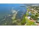 Wide aerial view of bay waters, waterfront property and upscale beach homes at 7620 Westmoreland Dr, Sarasota, FL 34243