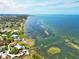 Coastal real estate with a stunning view of ocean waters and a pier at 7620 Westmoreland Dr, Sarasota, FL 34243