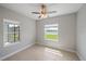 Well-lit room with tile flooring, a ceiling fan, and a scenic view of the outdoors at 7743 Ridgelake Cir, Bradenton, FL 34203