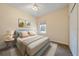 Cozy bedroom features a comfortable bed with decorative pillows, neutral tones and natural light at 7743 Ridgelake Cir, Bradenton, FL 34203