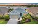 Charming single-Gathering home features a two-car garage, well-maintained landscaping, and a scenic lake view at 7743 Ridgelake Cir, Bradenton, FL 34203