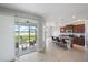 The kitchen features a center island with seating and views of the living room and outdoor patio and lake at 7743 Ridgelake Cir, Bradenton, FL 34203