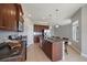 The kitchen features a center island, stainless appliances, and granite countertops at 7743 Ridgelake Cir, Bradenton, FL 34203
