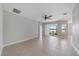 Bright living room with tile floors and view to the lake at 7743 Ridgelake Cir, Bradenton, FL 34203