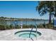 Community spa with view of the lake and surrounding landscape at 7743 Ridgelake Cir, Bradenton, FL 34203