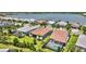 Backyard pools in a residential community, surrounded by lush greenery and screened enclosures at 8033 Grande Shores Dr, Sarasota, FL 34240