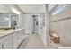 A bright bathroom with double vanity, walk-in shower with tile surround at 8033 Grande Shores Dr, Sarasota, FL 34240