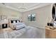 Comfortable bedroom with tray ceilings, natural light, and stylish decor at 8033 Grande Shores Dr, Sarasota, FL 34240