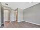 Empty room with luxury tile floors, neutral walls, and 2 doors at 8033 Grande Shores Dr, Sarasota, FL 34240