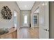 Spacious foyer featuring a decorative glass door and neutral color palette at 8033 Grande Shores Dr, Sarasota, FL 34240
