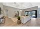 Spacious living room with coffered ceilings and expansive sliding glass doors at 8033 Grande Shores Dr, Sarasota, FL 34240