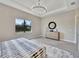 Spacious main bedroom with a large window, tray ceiling and luxury decor at 8033 Grande Shores Dr, Sarasota, FL 34240