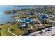 Aerial view showcases the community amenities, including pool, bocce ball, and playground at 8059 Waterbend Trl, Sarasota, FL 34240