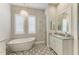 Elegant bathroom with standalone tub, chandelier, shuttered window, and tile flooring at 8059 Waterbend Trl, Sarasota, FL 34240