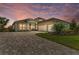 Beautiful home with a three-car garage, stylish shutters, and a well-manicured lawn at 8059 Waterbend Trl, Sarasota, FL 34240