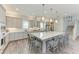 Spacious kitchen features a large center island, custom cabinets, and modern stainless steel appliances at 8059 Waterbend Trl, Sarasota, FL 34240