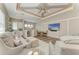 Upstairs living room featuring high ceilings and a convenient kitchenette area at 8059 Waterbend Trl, Sarasota, FL 34240