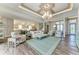 Spacious living room seamlessly connects kitchen, dining, and living spaces, offering an airy atmosphere at 8059 Waterbend Trl, Sarasota, FL 34240