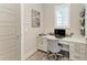 Home office featuring custom cabinets, granite countertops, modern light fixtures, and wood-look floors at 8059 Waterbend Trl, Sarasota, FL 34240