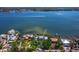 Expansive waterfront property showcasing stunning bay views and a private dock, perfect for boating and enjoying coastal living at 8155 Midnight Pass Rd, Sarasota, FL 34242