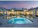 Expansive backyard with a modern pool, hot tub, and ample patio space, creating an outdoor oasis at 8155 Midnight Pass Rd, Sarasota, FL 34242