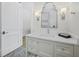 Bright bathroom with a white vanity, modern fixtures, and a clean, minimalist design at 8155 Midnight Pass Rd, Sarasota, FL 34242