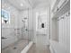 Bright bathroom featuring a glass shower and access to the vanity and walk-in closet at 8155 Midnight Pass Rd, Sarasota, FL 34242