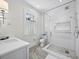 Modern bathroom featuring a glass shower, white subway tile, and a sleek vanity at 8155 Midnight Pass Rd, Sarasota, FL 34242