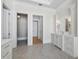 Spacious bathroom with vanity, sconces, tile floor, and entryways to adjacent spaces at 8155 Midnight Pass Rd, Sarasota, FL 34242