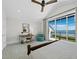 Bedroom with a view of the water, desk, chair, and ceiling fan at 8155 Midnight Pass Rd, Sarasota, FL 34242