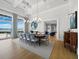 Formal dining area with large windows and elegant lighting fixtures at 8155 Midnight Pass Rd, Sarasota, FL 34242