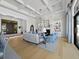 Open living room with coffered ceilings, fireplace, and grand entry at 8155 Midnight Pass Rd, Sarasota, FL 34242