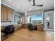 Spacious home office with custom built-ins, hardwood floors, and water view at 8155 Midnight Pass Rd, Sarasota, FL 34242