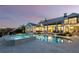 Luxurious backyard featuring a pool, spa, and inviting patio area, all complemented by a beautiful water view at 8155 Midnight Pass Rd, Sarasota, FL 34242