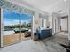 Exercise room with a wet bar, wine fridge, and large windows offering a clear view of the pool at 8155 Midnight Pass Rd, Sarasota, FL 34242