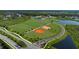Aerial view of athletic fields, baseball diamonds, and community park at 8355 Velda Trl, Sarasota, FL 34241