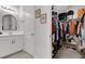 Bathroom and Walk-In Closet with well-organized clothing and shoe storage at 8355 Velda Trl, Sarasota, FL 34241