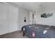 This bedroom has a large closet space, complimented by a dark, sports themed comforter on the bed at 8355 Velda Trl, Sarasota, FL 34241