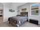 Comfortable bedroom with wood furniture and cozy bedding. Features ample light at 8355 Velda Trl, Sarasota, FL 34241