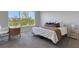 Bright bedroom with large windows, cozy decor and a desk for working at 8355 Velda Trl, Sarasota, FL 34241
