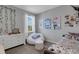 Teen bedroom with decorative art, light walls, and ample natural light at 8355 Velda Trl, Sarasota, FL 34241